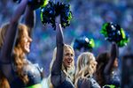 Oct 6, 2024; Seattle, Washington, USA; A Seattle Seahawks cheerleader stands on the sideline during the fourth quarter against the New York Giants at Lumen Field. Mandatory Credit: Joe Nicholson-Imagn Images