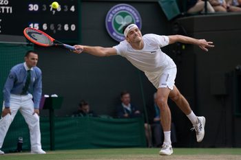 Jul 10, 2024; London, United Kingdom; Taylor Fritz of the United States returns a shot during his match against Lorenzo Musetti of Italy (not shown) on day 10 at All England Lawn Tennis and Croquet Club. Mandatory Credit: Susan Mullane-Imagn Images
