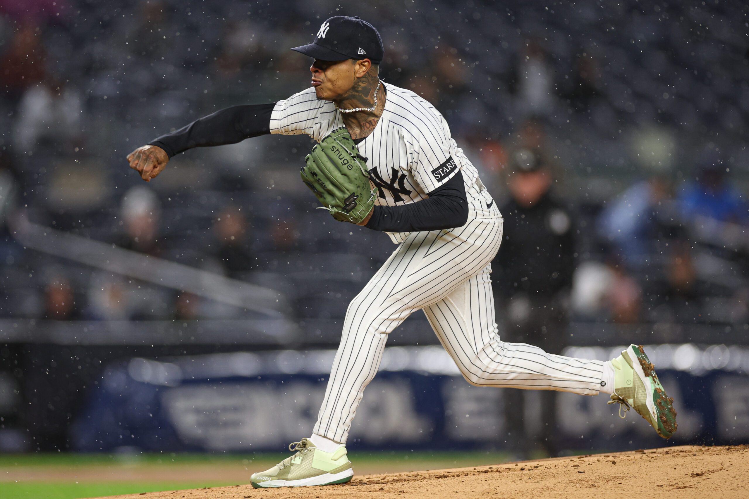 Apr 11, 2025; Bronx, New York, USA; New York Yankees starting pitcher Marcus Stroman (0) delivers a pitch during the first inning against the San Francisco Giants at Yankee Stadium. Mandatory Credit: Vincent Carchietta-Imagn Images