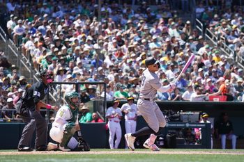 May 11, 2025; West Sacramento, California, USA; New York Yankees right fielder Aaron Judge (99) hits a single against the Athletics in the fifth inning at Sutter Health Park. Mandatory Credit: Cary Edmondson-Imagn Images