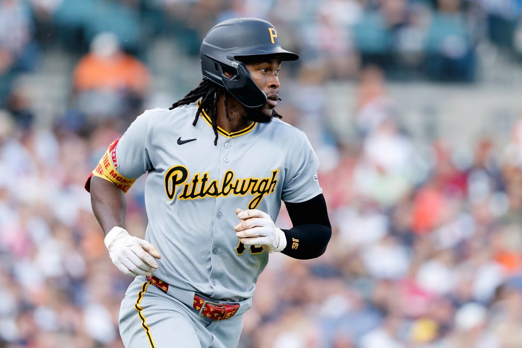 Jun 17, 2025; Detroit, Michigan, USA;  Pittsburgh Pirates outfielder Oneil Cruz (15) runs to first after hitting a single in the fourth inning against the Detroit Tigers at Comerica Park. Mandatory Credit: Rick Osentoski-Imagn Images