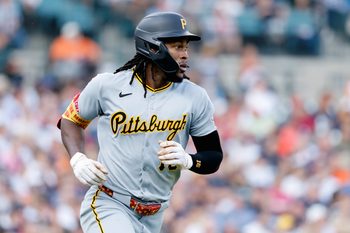 Jun 17, 2025; Detroit, Michigan, USA;  Pittsburgh Pirates outfielder Oneil Cruz (15) runs to first after hitting a single in the fourth inning against the Detroit Tigers at Comerica Park. Mandatory Credit: Rick Osentoski-Imagn Images