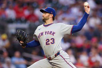 Jun 17, 2025; Atlanta, Georgia, USA; New York Mets starting pitcher David Peterson (23) throws against the Atlanta Braves in the first inning at Truist Park. Mandatory Credit: Brett Davis-Imagn Images