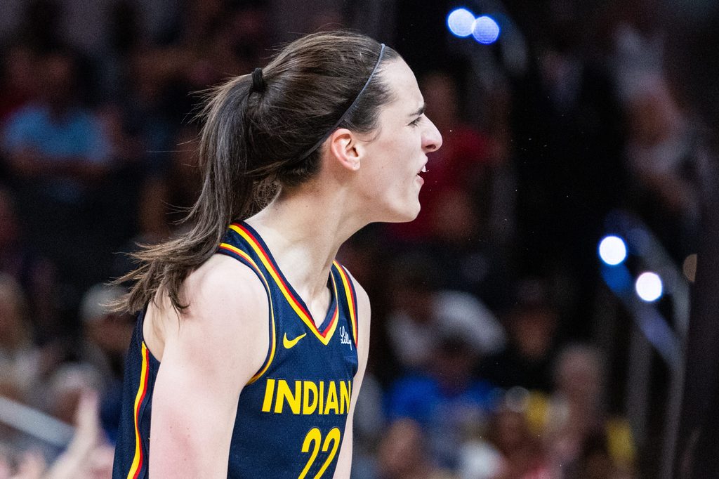 Jun 17, 2025; Indianapolis, Indiana, USA; Indiana Fever guard Caitlin Clark (22) celebrates in the second half against the Connecticut Sun at Gainbridge Fieldhouse. Mandatory Credit: Trevor Ruszkowski-Imagn Images