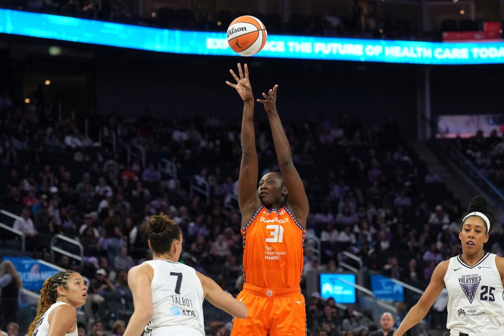 Jun 22, 2025; San Francisco, California, USA; Connecticut Sun center Tina Charles (31) shoots against Golden State Valkyries forward Stephanie Talbot (7) during the third quarter at Chase Center. Mandatory Credit: Darren Yamashita-Imagn Images