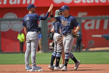 Jun 26, 2025; Kansas City, Missouri, USA;  Tampa Bay Rays left fielder Jake Mangum (28) celebrates with teammate second base Brandon Lowe (8) after beating the Kansas City Royals at Kauffman Stadium. Mandatory Credit: Peter Aiken-Imagn Images