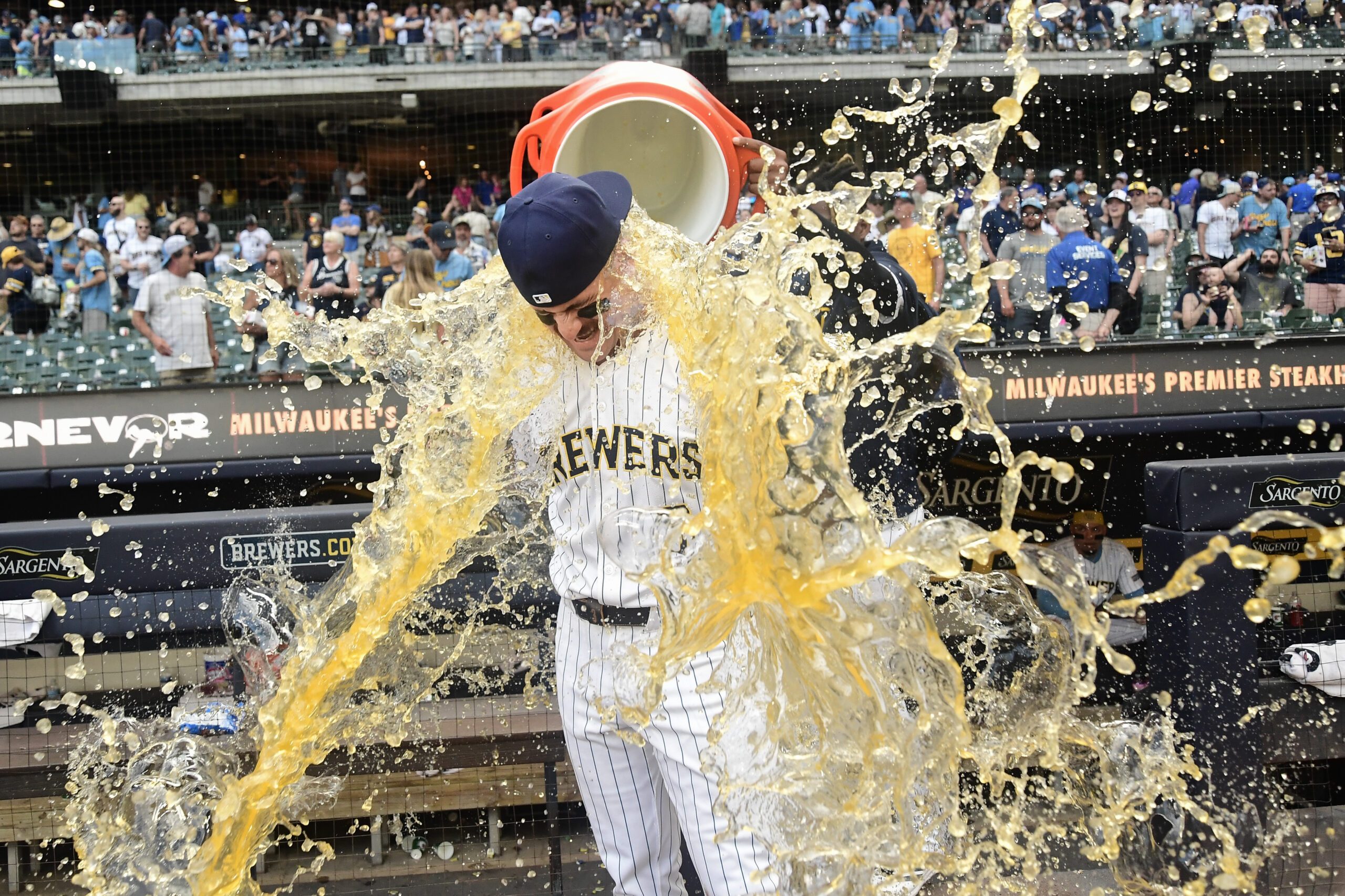 Jun 28, 2025; Milwaukee, Wisconsin, USA;  Milwaukee Brewers shortstop Joey Ortiz (3) gets the post game dunk after the Brewers defeated the Colorado Rockies at American Family Field. Mandatory Credit: Benny Sieu-Imagn Images