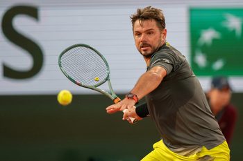 May 26, 2024; Paris, France; Stan Wawrinka of Switzerland returns a shot during his match against Andy Murray of Great Britain on day one of Roland Garros at Stade Roland Garros. Mandatory Credit: Susan Mullane-Imagn Images