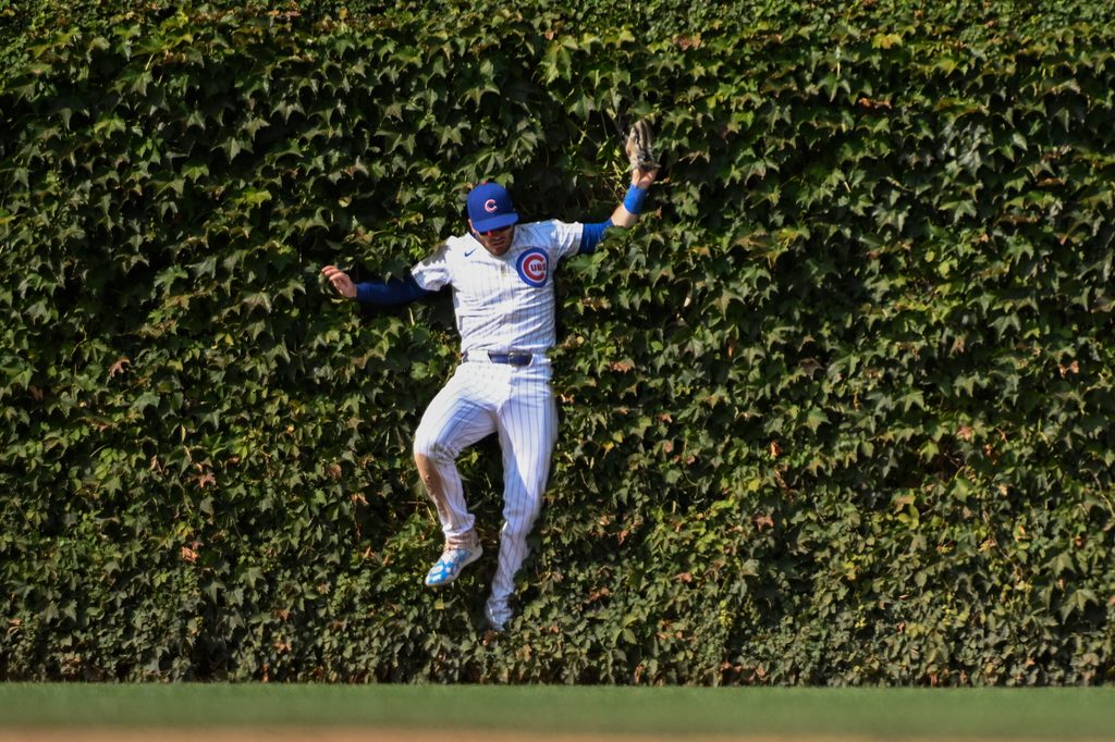 Sep 8, 2024; Chicago, Illinois, USA;  Chicago Cubs outfielder Ian Happ (8) catches a fly ball hit by New York Yankees catcher Austin Wells (28) during the eighth inning at Wrigley Field. Mandatory Credit: Matt Marton-Imagn Images