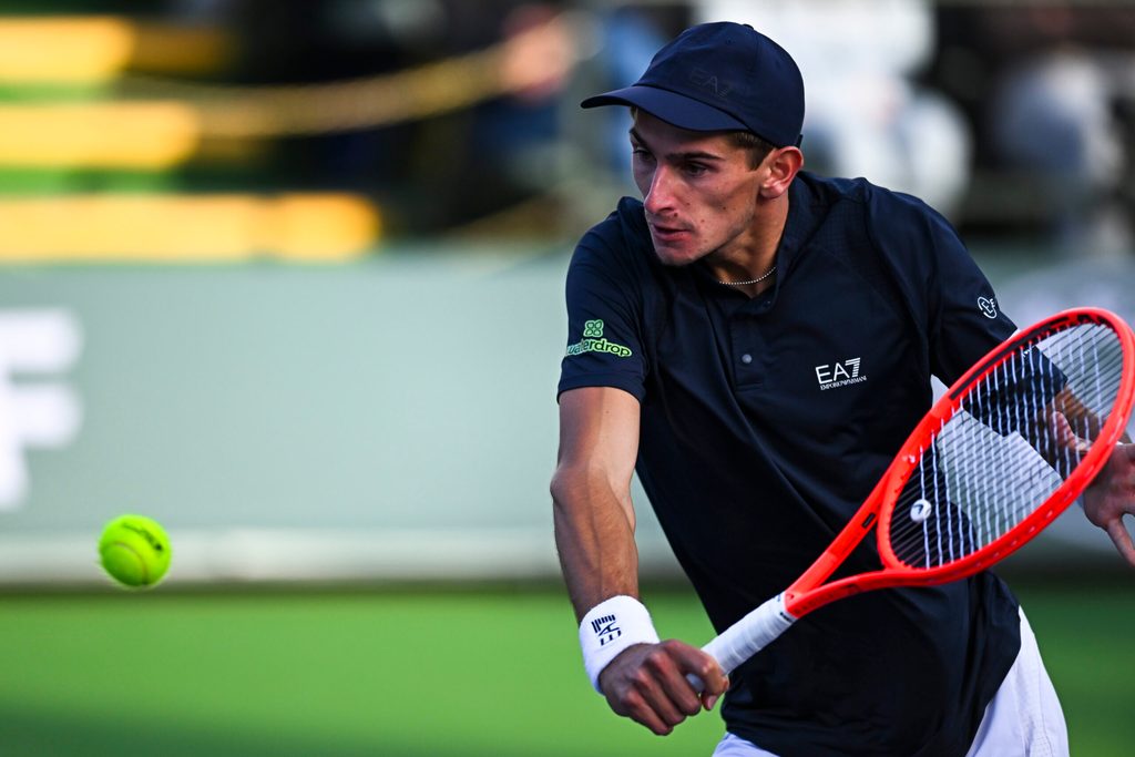 Mar 6, 2025; Indian Wells, CA, USA; Matteo Arnaldi (ITA) hits a ball against Aleksander Kovacevic (USA) in the BNP Paribas Open at the Indian Well Tennis Garden. Mandatory Credit: Jonathan Hui-Imagn Images