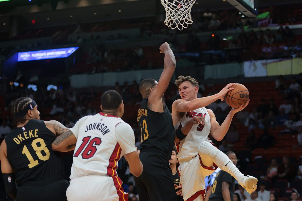 Apr 28, 2025; Miami, Florida, USA; Miami Heat guard Pelle Larsson (9) drives to the basket against the Cleveland Cavaliers in the fourth quarter during game four for the first round of the 2025 NBA Playoffs at Kaseya Center. Mandatory Credit: Sam Navarro-Imagn Images