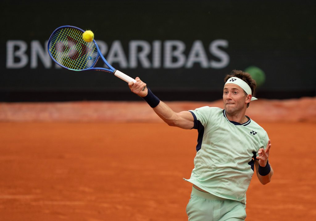 May 28, 2025; Paris, FR; Casper Ruud of Norway returns a shot during his match against Nuno Borges of Portugal on day four at Roland Garros Stadium. Mandatory Credit: Susan Mullane-Imagn Images