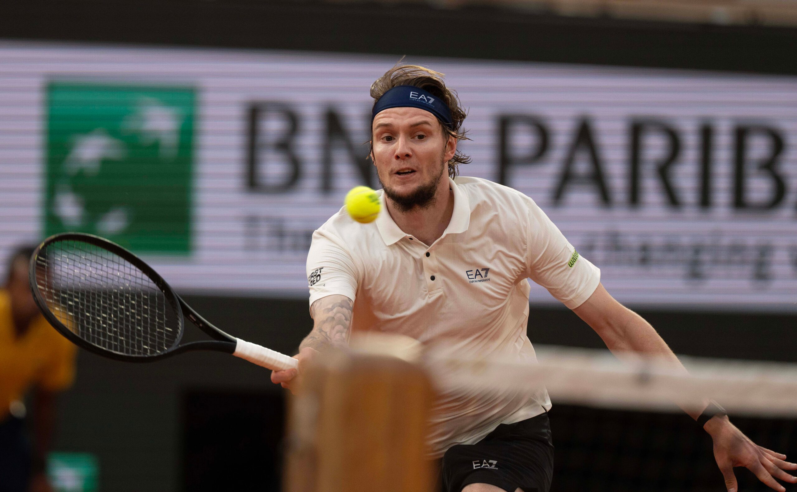 Jun 4, 2025; Paris, FR; Alexander Bublik of Kazakhstan returns a shot during his match against Jannik Sinner of Italy on day 11 at Roland Garros Stadium.  Mandatory Credit: Susan Mullane-Imagn Images