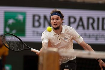 Jun 4, 2025; Paris, FR; Alexander Bublik of Kazakhstan returns a shot during his match against Jannik Sinner of Italy on day 11 at Roland Garros Stadium.  Mandatory Credit: Susan Mullane-Imagn Images