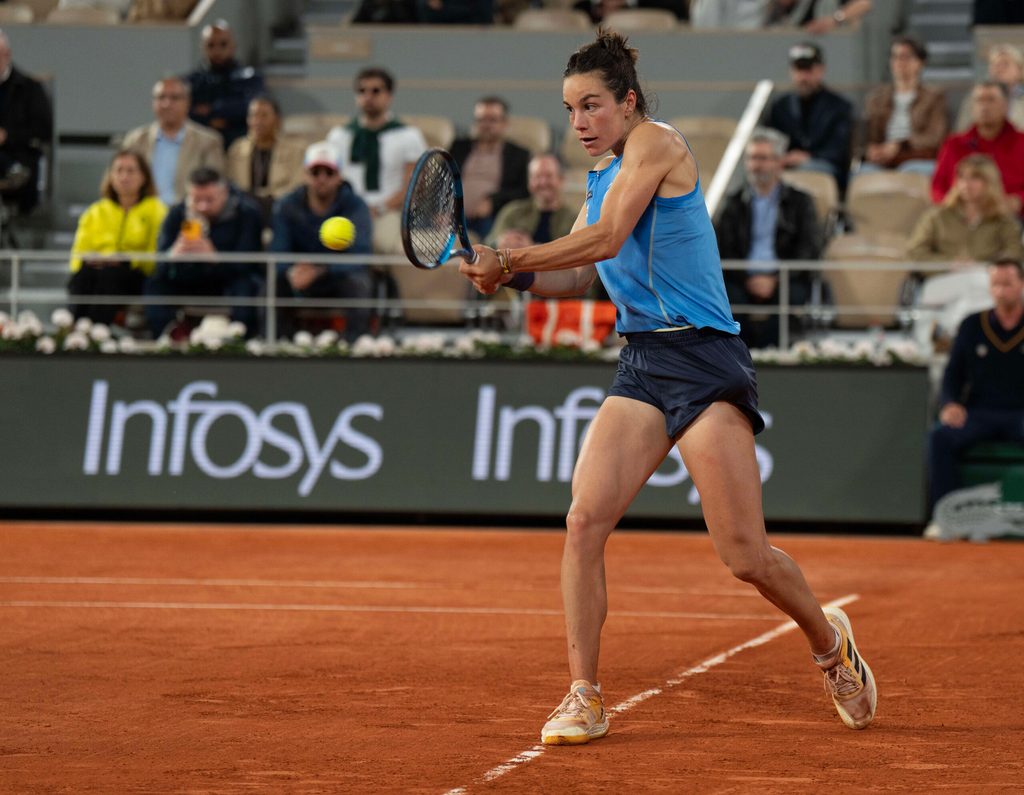 Jun 5, 2025; Paris, FR; Lois Boisson of France returns a shot during her match against Coco Gauff of the United States on day 12 at Roland Garros Stadium. Mandatory Credit: Susan Mullane-Imagn Images