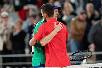 Jun 6, 2025; Paris, FR;  Jannik Sinner of Italy at the net with Novak Djokovic of Serbia  after their match on day 13 at Roland Garros Stadium. Mandatory Credit: Susan Mullane-Imagn Images
