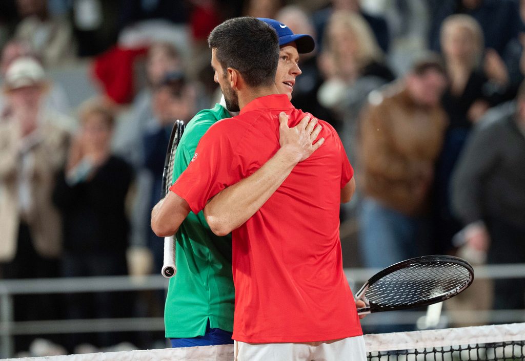 Jun 6, 2025; Paris, FR; Jannik Sinner of Italy at the net with Novak Djokovic of Serbia after their match on day 13 at Roland Garros Stadium. Mandatory Credit: Susan Mullane-Imagn Images