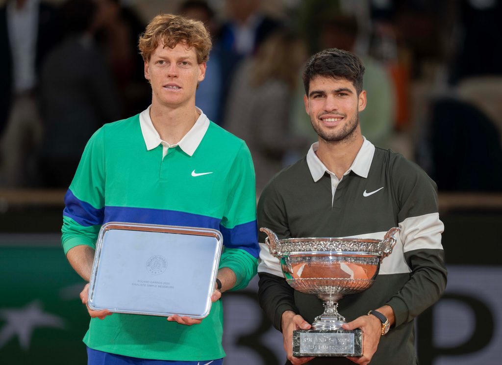 Jun 8, 2025; Paris, FR; Jannik Sinner of Italy and Carlos Alcaraz of Spain pose together at the trophy presentation after the men’s singles final on day 15 at Roland Garros Stadium. Mandatory Credit: Susan Mullane-Imagn Images