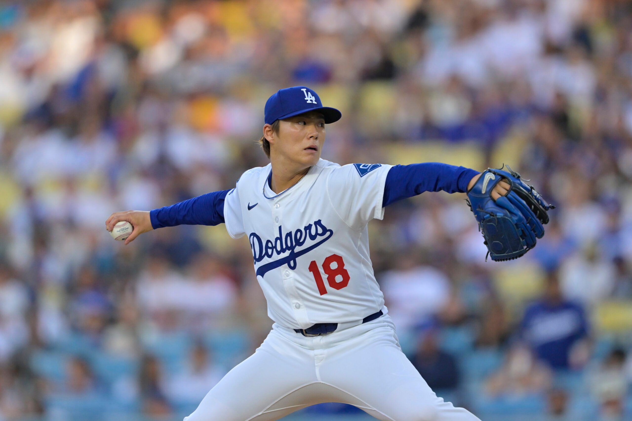 Jun 19, 2025; Los Angeles, California, USA;  Los Angeles Dodgers pitcher Yoshinobu Yamamoto (18) delivers a pitch during the first inning against the San Diego Padres at Dodger Stadium. Mandatory Credit: Jayne Kamin-Oncea-Imagn Images