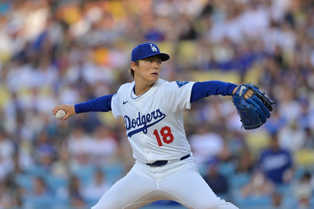 Jun 19, 2025; Los Angeles, California, USA;  Los Angeles Dodgers pitcher Yoshinobu Yamamoto (18) delivers a pitch during the first inning against the San Diego Padres at Dodger Stadium. Mandatory Credit: Jayne Kamin-Oncea-Imagn Images