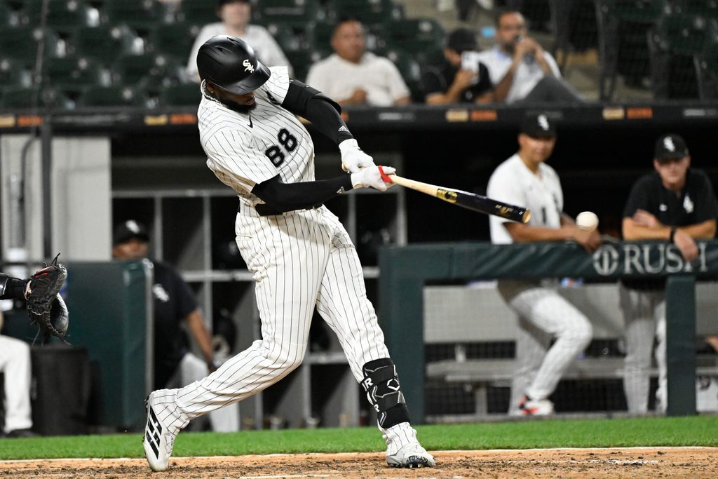 Jun 23, 2025; Chicago, Illinois, USA;  Chicago White Sox outfielder Luis Robert Jr. (88) hits a single during the ninth inning against the Arizona Diamondbacks at Rate Field. Mandatory Credit: Matt Marton-Imagn Images