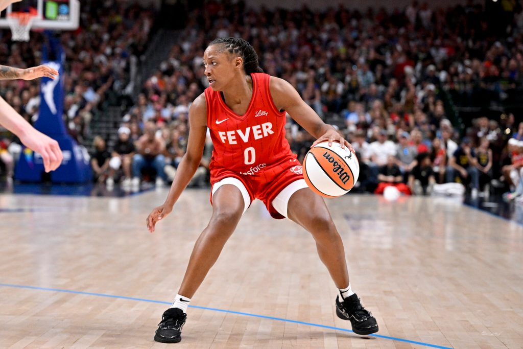 Jun 27, 2025; Dallas, Texas, USA; Indiana Fever guard Kelsey Mitchell (0) brings the ball up court against the Dallas Wings during the second half at the American Airlines Center. Mandatory Credit: Jerome Miron-Imagn Images