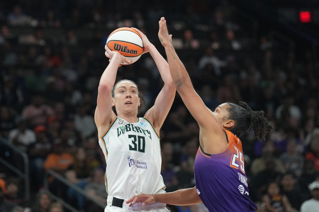 Jun 27, 2025; Phoenix, Arizona, USA; New York Liberty forward Breanna Stewart (30) shoots over Phoenix Mercury forward Alyssa Thomas (25) during the second half at Footprint Center. Mandatory Credit: Joe Camporeale-Imagn Images