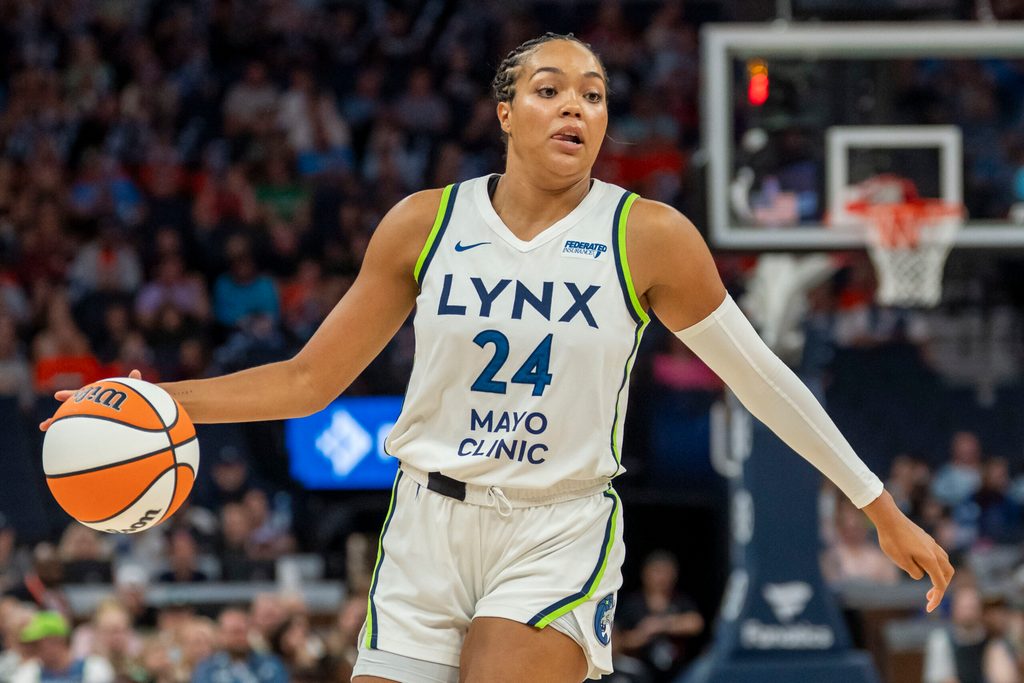 Jun 29, 2025; Minneapolis, Minnesota, USA; Minnesota Lynx forward Napheesa Collier (24) dribbles the ball against the Connecticut Sun in the first half at Target Center. Mandatory Credit: Jesse Johnson-Imagn Images