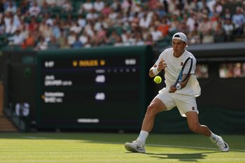 Jul 1, 2025; Wimbledon United Kingdom; Jack Draper (GBR) hits a forehand against Sebastian Báez (ARG)(not pictured) on day 2 of The Championships, Wimbledon 2025 at All England Lawn Tennis and Croquet Club. Mandatory Credit: Geoff Burke-Imagn Images