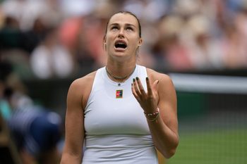 Jul 2, 2025; Wimbledon, United Kingdom; Aryna Sabalenka reacts to a point during her match against Marie Bouzkova of the Czech Republic on day three at the All England Lawn Tennis and Croquet Club. Mandatory Credit: Susan Mullane-Imagn Images