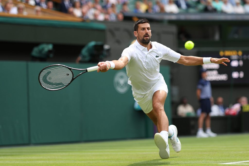 Jul 3, 2025; Wimbledon, United Kingdom; Novak Djokovic (SRB) reaches for a forehand against Daniel Evans (GBR)(not pictured) on day four of The Championships Wimbledon 2025 at All England Lawn Tennis and Croquet Club. Mandatory Credit: Geoff Burke-Imagn Images