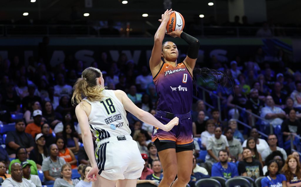 Jul 3, 2025; Arlington, Texas, USA; Phoenix Mercury forward Satou Sabally (0) shoots over Dallas Wings center Luisa Geiselsoder (18) during the second half at College Park Center. Mandatory Credit: Kevin Jairaj-Imagn Images