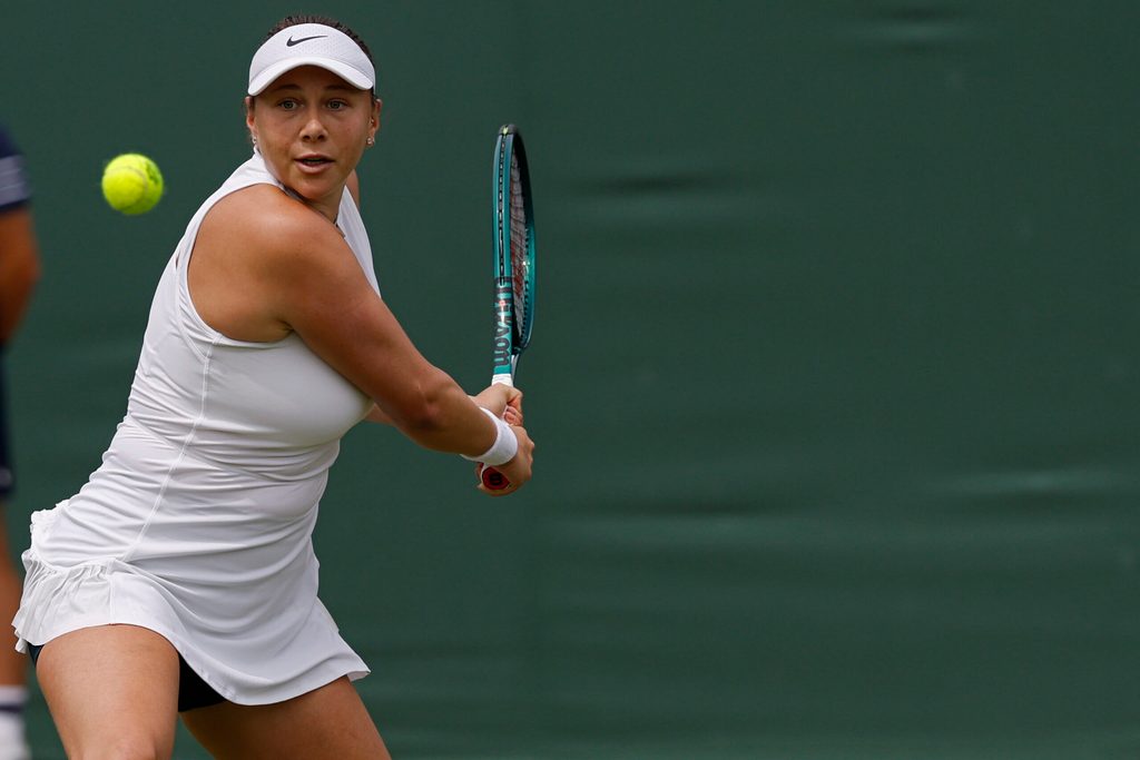 Jul 4, 2025; Wimbledon, United Kingdom; Amanda Anisimova (USA) hits a backhand against Dalma Galfi (HUN)(not pictured) on day five of The Championships Wimbledon 2025 at All England Lawn Tennis and Croquet Club. Mandatory Credit: Geoff Burke-Imagn Images