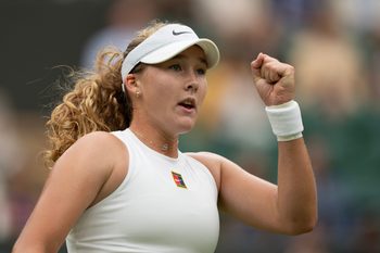 Jul 5, 2025; Wimbledon, United Kingdom;  Mirra Andreeva reacts to a point during her match against Hailey Baptiste of the United States on day six at the All England Lawn Tennis and Croquet Club. Mandatory Credit: Susan Mullane-Imagn Images