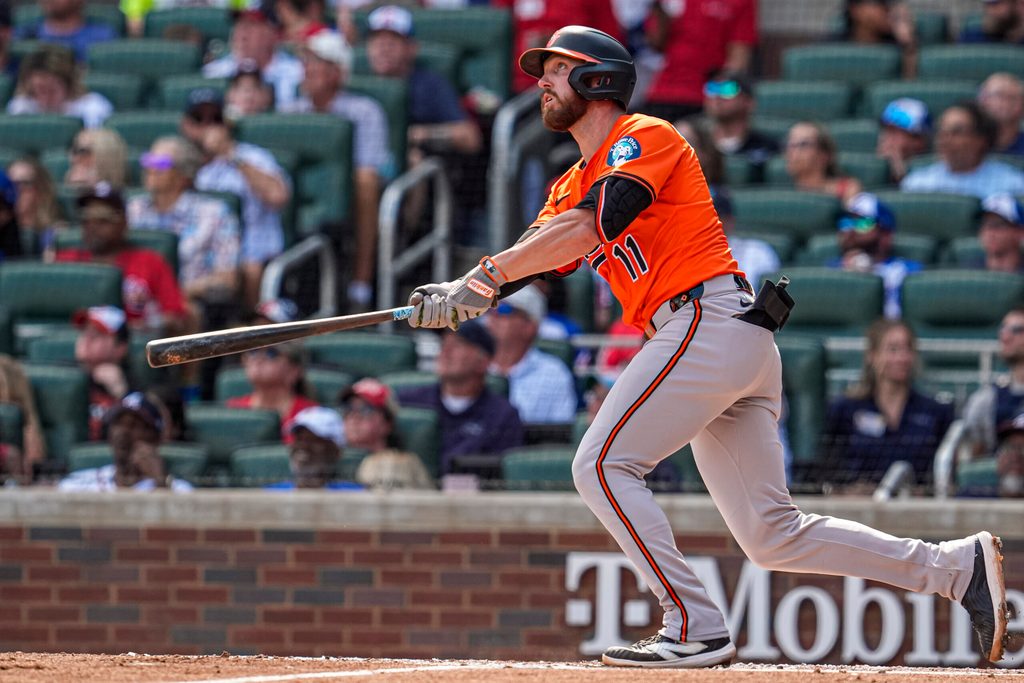 Jul 5, 2025; Cumberland, Georgia, USA; Baltimore Orioles third baseman Jordan Westburg (11) hits a two run home run against the Atlanta Braves during the third inning at Truist Park. Mandatory Credit: Dale Zanine-Imagn Images