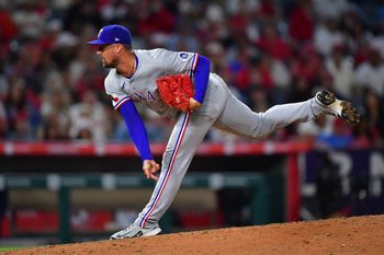 Jul 7, 2025; Anaheim, California, USA; Texas Rangers pitcher Shawn Armstrong (43) throws against the Los Angeles Angels during the sixth inning at Angel Stadium. Mandatory Credit: Gary A. Vasquez-Imagn Images