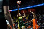 Jul 9, 2025; Uncasville, Connecticut, USA; Seattle Storm guard Skylar Diggins (4) shoots the ball against Connecticut Sun center Olivia Nelson-Ododa (10) in the first half at Mohegan Sun Arena. Mandatory Credit: David Butler II-Imagn Images