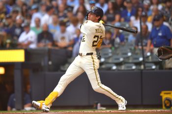 Jul 9, 2025; Milwaukee, Wisconsin, USA; Milwaukee Brewers designated hitter Christian Yelich (22) hits a single during the second inning against the Los Angeles Dodgers at American Family Field. Mandatory Credit: Patrick Gorski-Imagn Images