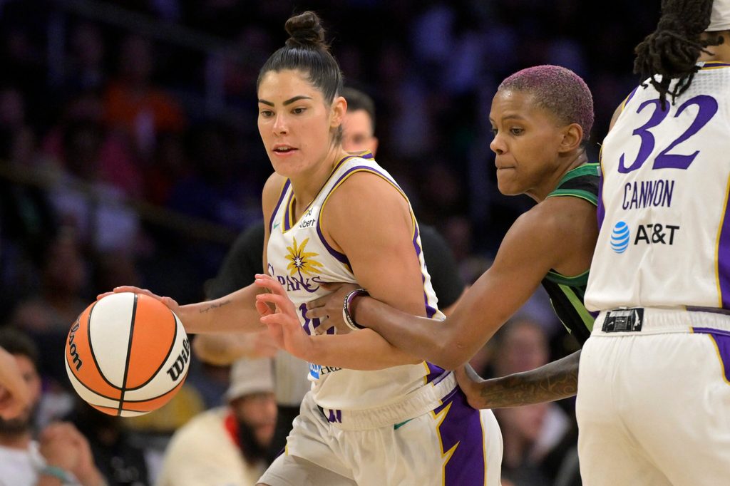 Jul 10, 2025; Los Angeles, California, USA; Los Angeles Sparks guard Kelsey Plum (10) drives past Minnesota Lynx guard Courtney Williams (10) in the second half at Crypto.com Arena. Mandatory Credit: Jayne Kamin-Oncea-Imagn Images