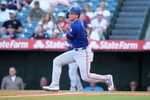 Jul 10, 2025; Anaheim, California, USA; Texas Rangers shortstop Corey Seager (5) hits a single in the first inning against the Los Angeles Angels at Angel Stadium. Mandatory Credit: Kirby Lee-Imagn Images