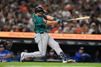 Jul 11, 2025; Detroit, Michigan, USA;  Seattle Mariners designated hitter Cal Raleigh (29) hits a grand slam home run against the Detroit Tigers in the ninth inning at Comerica Park. Mandatory Credit: Lon Horwedel-Imagn Images
