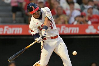 Jul 12, 2025; Anaheim, California, USA;  Los Angeles Angels right fielder Mike Trout (27) hits a two-run home run during the fifth inning against the Arizona Diamondbacks at Angel Stadium. Mandatory Credit: Jayne Kamin-Oncea-Imagn Images