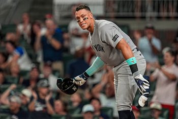 Jul 18, 2025; Cumberland, Georgia, USA; New York Yankees right fielder Aaron Judge (99) reacts after striking out against the  Atlanta Braves during the seventh inning at Truist Park. Mandatory Credit: Dale Zanine-Imagn Images