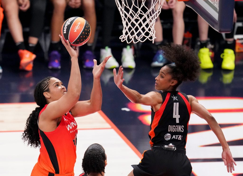 Atlanta Dream's Brionna Jones (24) goes up at the basket while being guarded by Seattle Storm's Skylar Diggins (4) on Saturday, July 19, 2025, during the WNBA All-Star Game at Gainbridge Fieldhouse in Indianapolis.