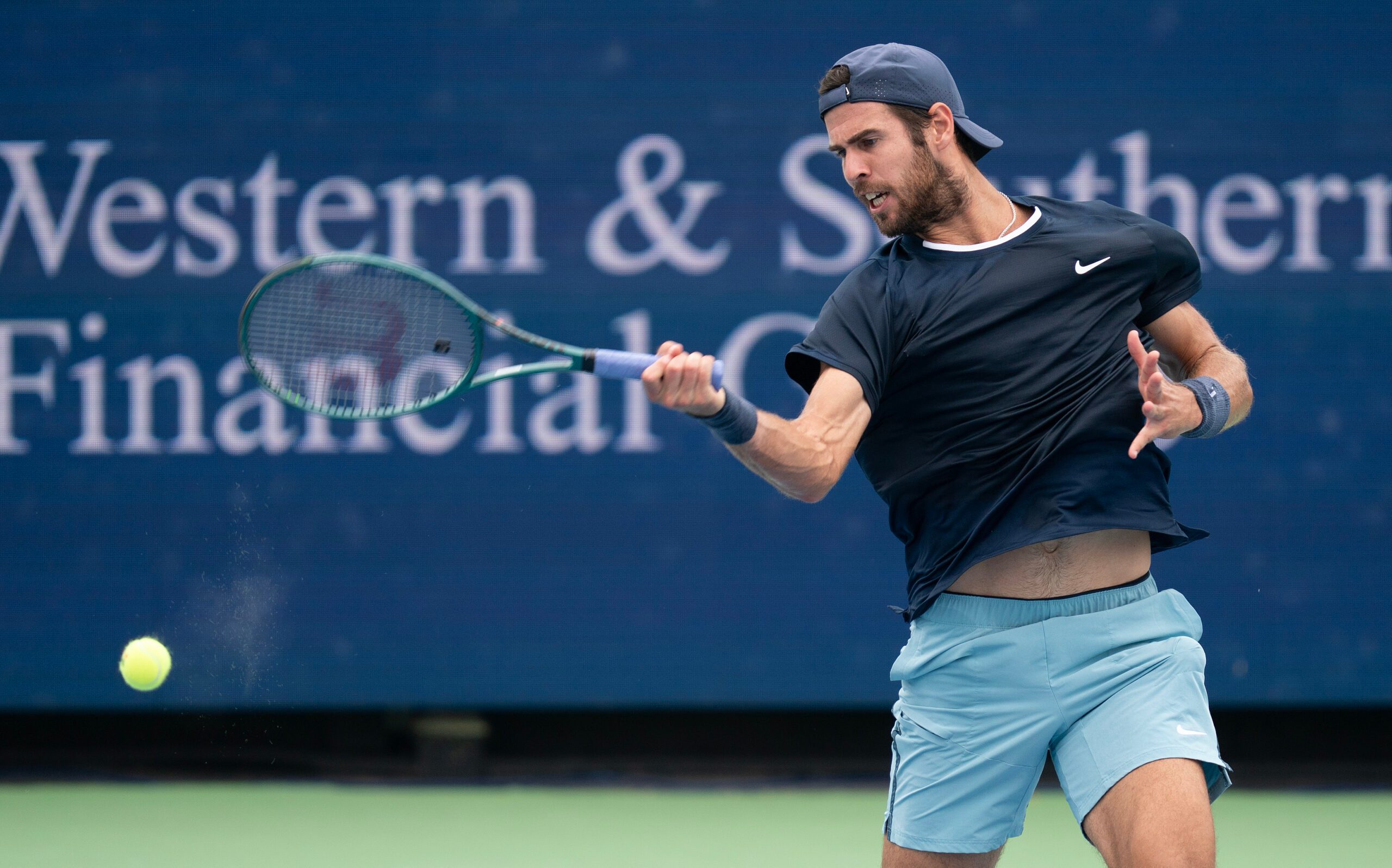 Aug 15, 2024; Cincinnati, OH, USA ; Karen Khachanov returns a shot against  Alexander Zverev of Germany on day four of the Cincinnati Open. Mandatory Credit: Susan Mullane-Imagn Images