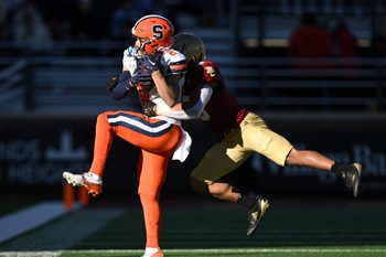 Nov 9, 2024; Chestnut Hill, Massachusetts, USA; Syracuse Orange wide receiver Trebor Pena (2) makes a catch in front of Boston College Eagles defensive back Khari Johnson (3) during the second half at Alumni Stadium. Mandatory Credit: Brian Fluharty-Imagn Images