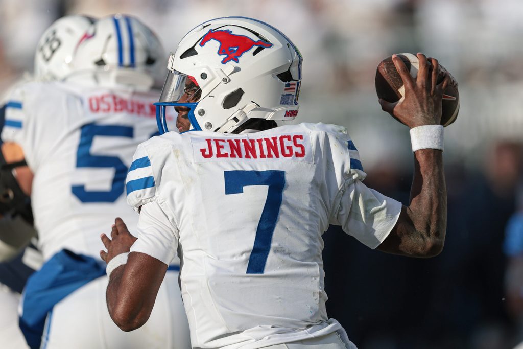 Dec 21, 2024; University Park, Pennsylvania, USA; Southern Methodist Mustangs quarterback Kevin Jennings (7) throws the ball during the second half against the Penn State Nittany Lions at Beaver Stadium. Mandatory Credit: Vincent Carchietta-Imagn Images