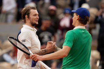 Jun 4, 2025; Paris, FR; Jannik Sinner of Italy at the net with Alexander Bublik of Kazakhstan after their match on day 11 at Roland Garros Stadium.  Mandatory Credit: Susan Mullane-Imagn Images