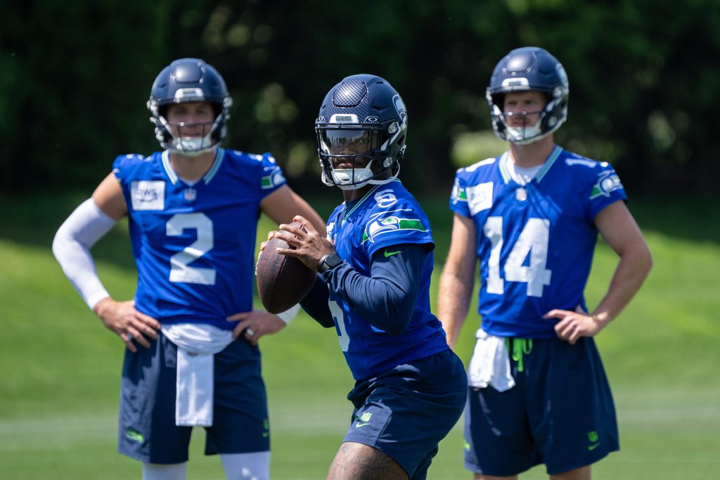 Jun 11, 2025; Renton, WA, USA; Seattle Seahawks quarterback Jalen Milroe (6) looks to pass as quarterback Drew Lock (2) and quarterback Sam Darnold (14) during mini-camp at Virginia Mason Athletic Center. Mandatory Credit: Stephen Brashear-Imagn Images