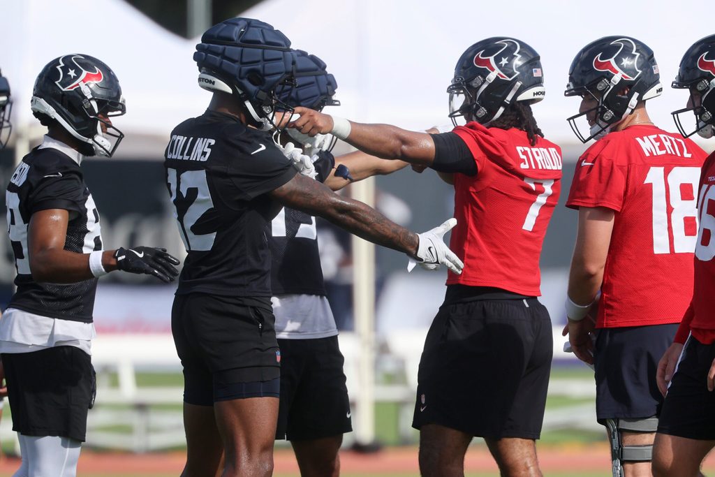 Jul 24, 2025; Houston, TX, USA; Houston Texans wide receiver Nico Collins (12) and quarterback C.J. Stroud (7) during training camp at Houston Methodist Training Center. Mandatory Credit: Troy Taormina-Imagn Images